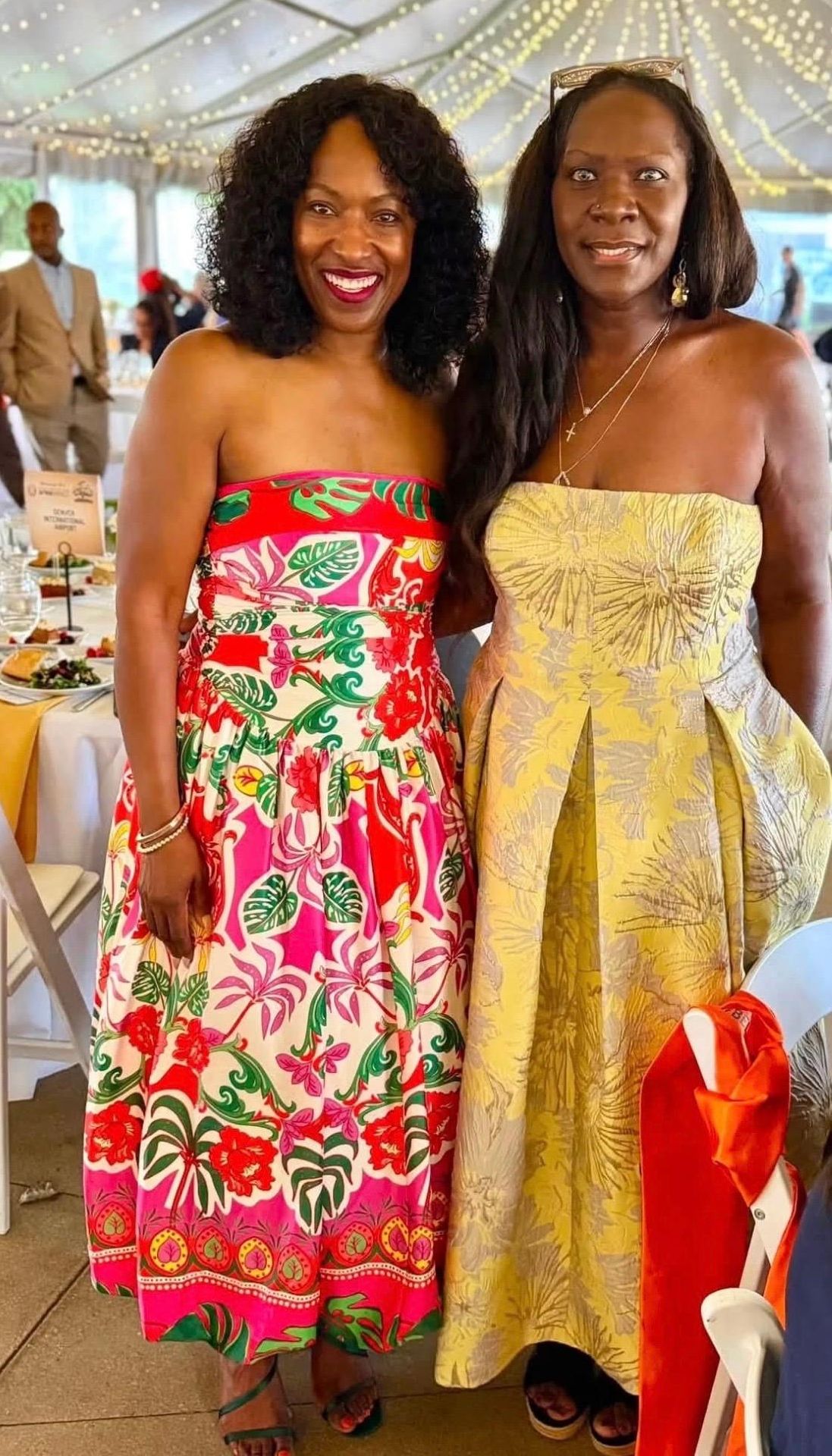 Aurora community leader Angela Garland (left) and Board Secretary Gayla Charrier attending the AfrikImpact event. 