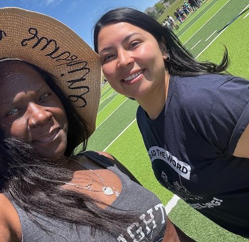 board secretary Gayla Charrier at left with an APS staff member at the Unified Sports Field Day