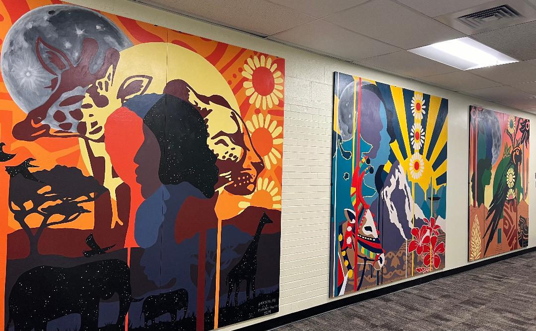 Community-created murals outside Crawford’s Media Center