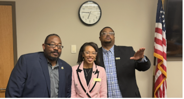 three board members from left including outgoing Board member Michael Carter, current Board member Tiffany Tasker, and Board President Tramaine Duncan