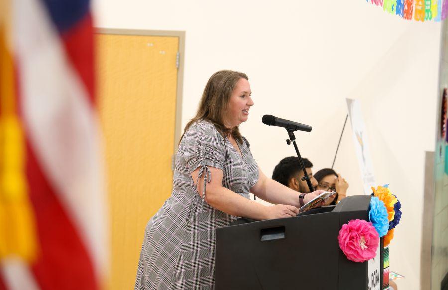 Board Director Kristin Mallory speaking in English and Spanish at the Escuela Bilingüe Betty Benavidez Grand Opening.