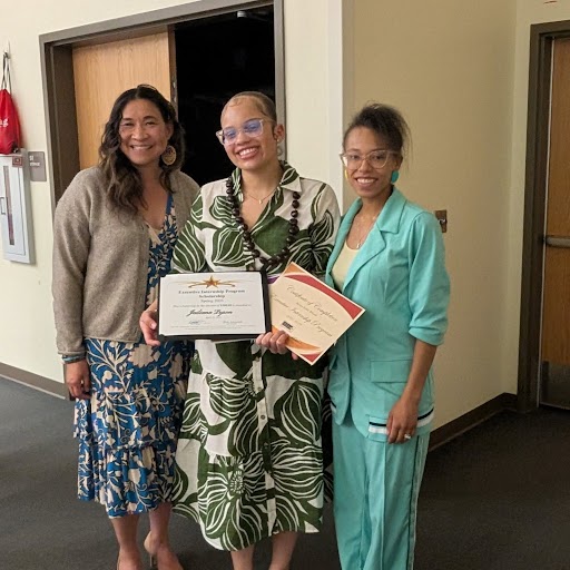 Board Vice President Danielle Tomwing and Board Treasurer Tiffany Tasker with a Executive Internship student showing here certificates of completion