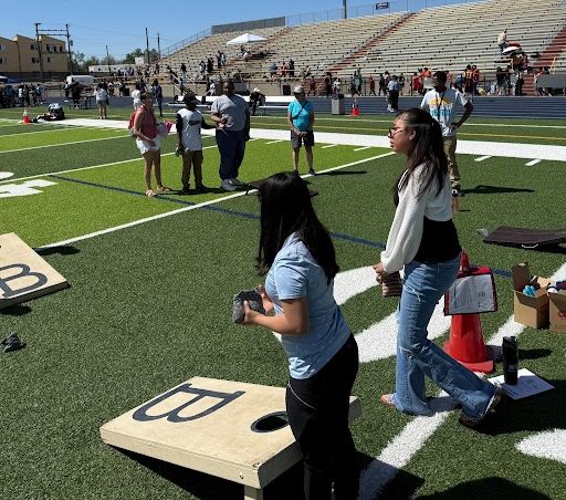 unified sports students participating in a Bean Bag Toss during field day