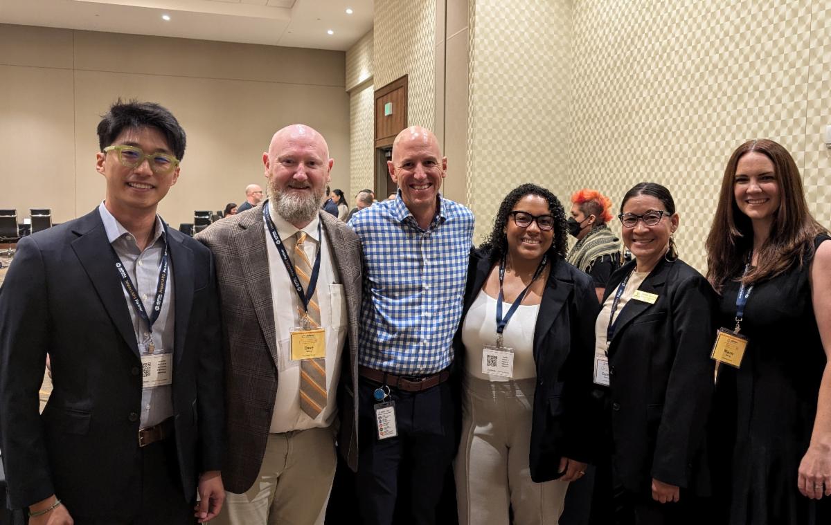 From left: APS Employment Engagement Coordinator Junho Doo, College & Career Success Director Dave West, Chief of School Leadership & Support Craig Lyle, Executive Director of Culture, Equity & Engagement Jaelyn Coates, Board Treasurer Danielle Tomwing and Community Engagement Coordinator Amanda Young attending the APS Impact event.