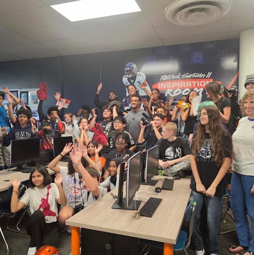 Columbia Middle School students celebrate the grand opening of the Patrick Surtain II STEAM Inspiration Room.