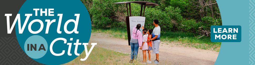 Family in a local trail looking at a map 