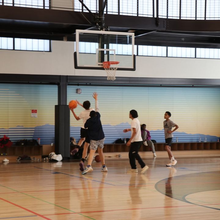 Group of teenagers playing basketball at a local recreation center graphic to webpage with more information