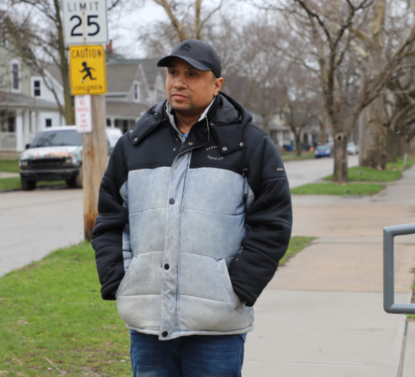 Antonio walking on the sidewalk