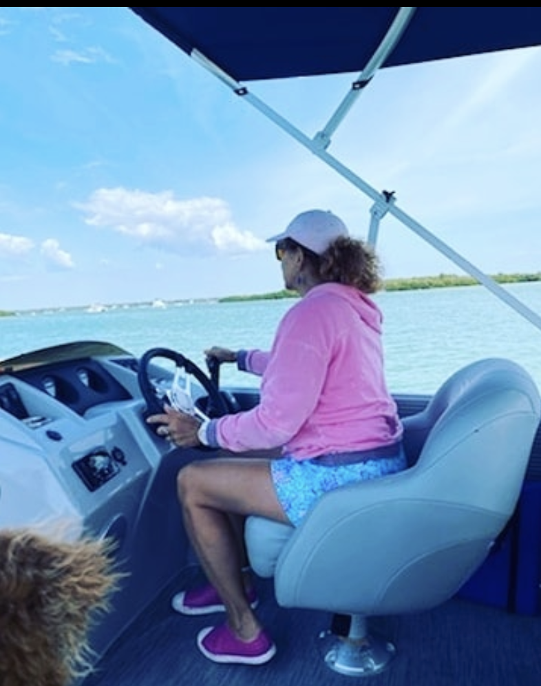 Suz driving boat photo