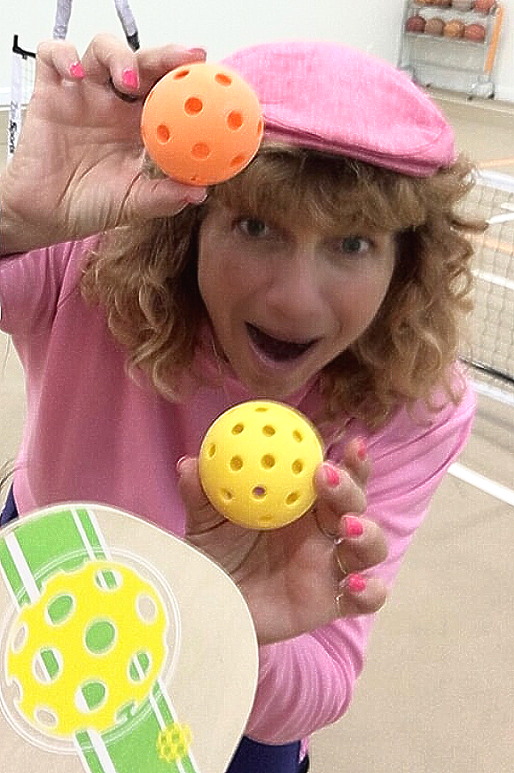 suz photo holding pickleballs