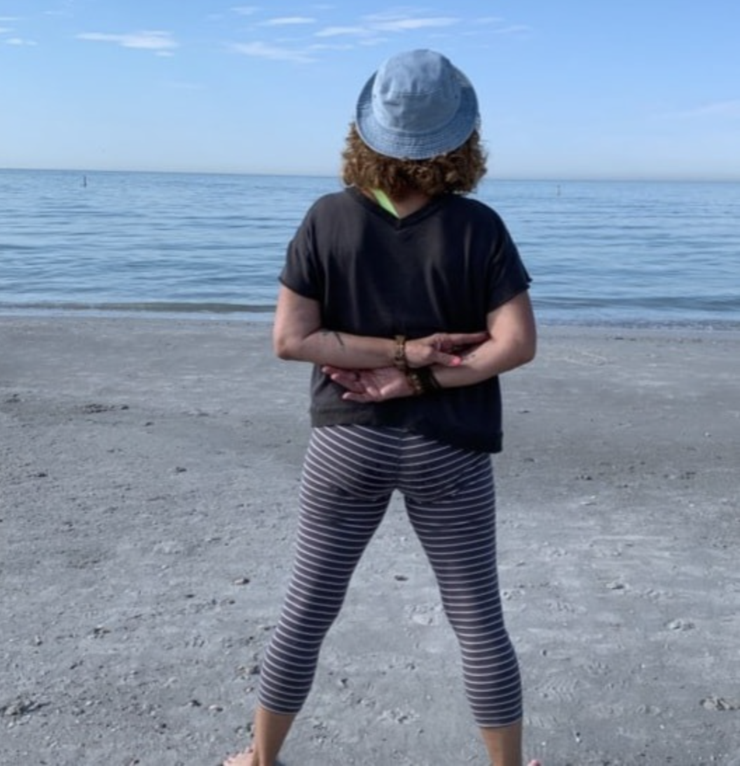 suz photo at yoga from behind on beach