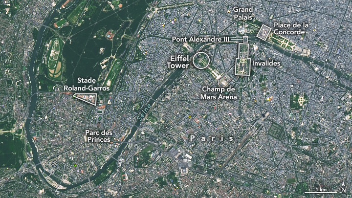 A natural-color Landsat 9 satellite image of Paris, France. White borders and text in this image highlight the Grand Palais, Place de la Concorde, Pont Alexandre III, Invalides, The Eiffel Tower, Champ de Mars Arena, Stade Roland-Garros, and Parc des Princes. This image was acquired on June 7, 2024. 
