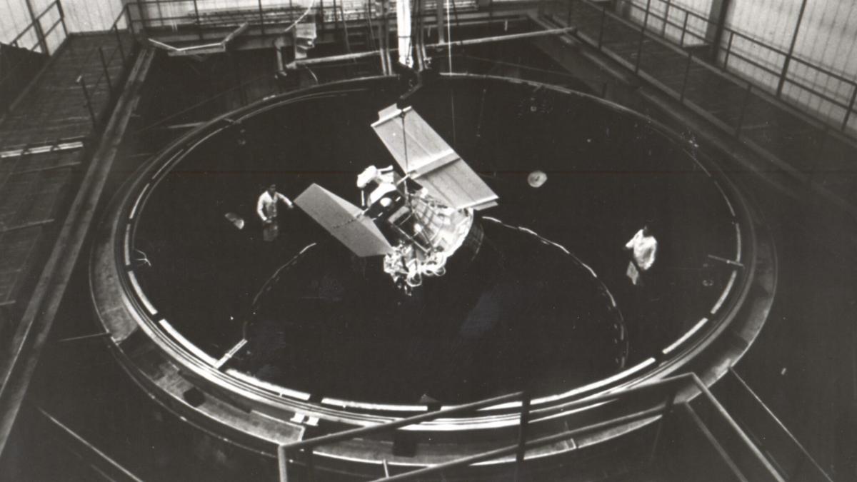 The Earth Resources Technology Satellite (ERTS) mockup in a spin test chamber at GE Space Division in Valley Forge PA