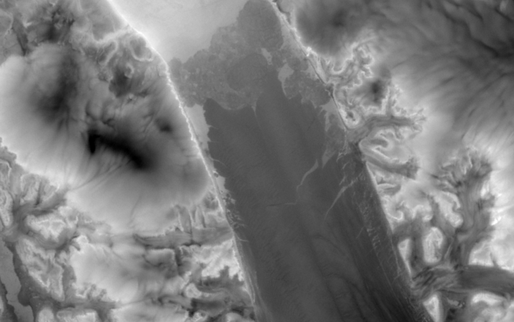 This twilight thermal infrared image of Petermann Glacier, Greenland, was captured by Landsat 9 on January 5, 2024. This winter image displays data acquired when the sun was below the horizon. Darker areas are relatively colder than bright areas. 