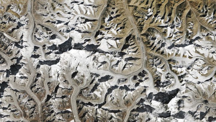 Landsat 9 satellite image of Mount Everest, acquired on January 20, 2025. The image is predominantly brown. There is only white snow on some of the tallest mountains. 