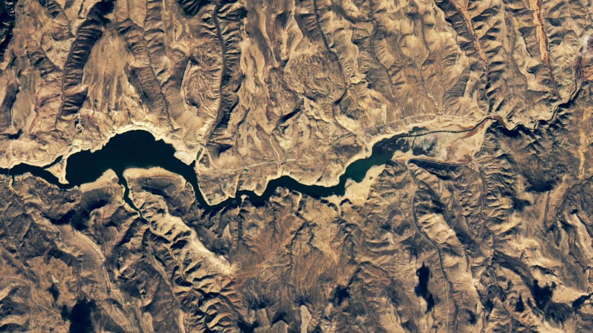 An image that shows the Blue Mesa Reservoir in November 2021, when water levels were much lower and its color was much greener.
