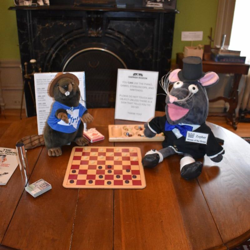 Loveable Beaver Archie plays board games with his pal, Zopher the Mouse.