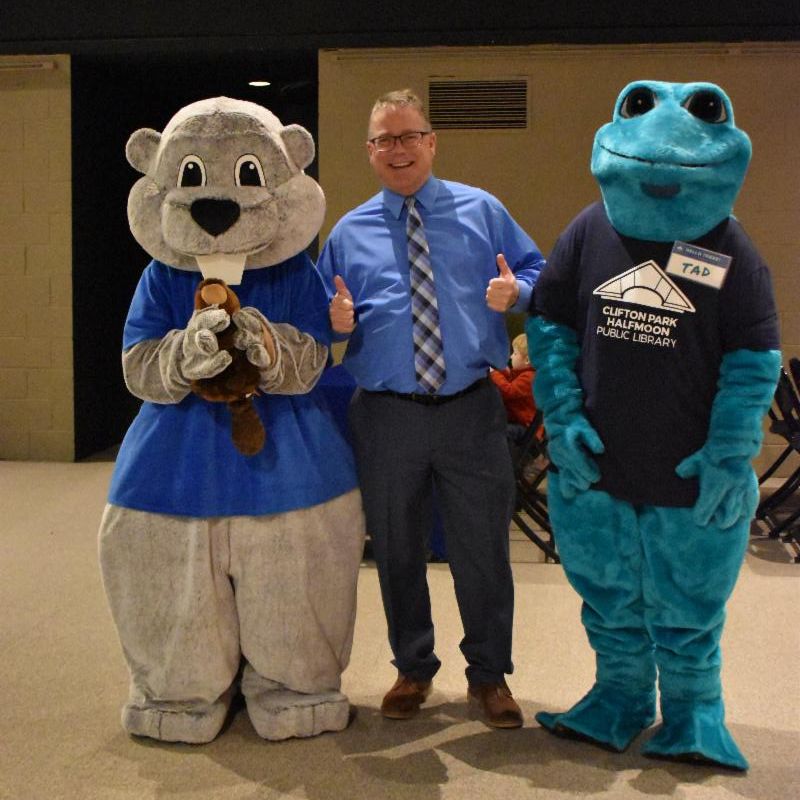 Archie the Jr! Archivist and his BFF Tad the Frog celebrates with State Archivist Brian Keough in a group photo
