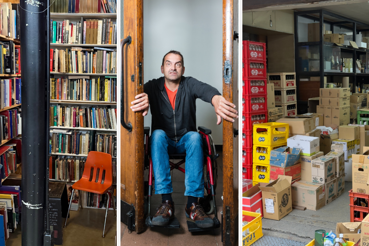Man in wheelchair demonstrating that a supply closet door is not wide enough for him to enter.