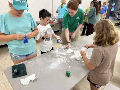 close up of participants making sensory items for the altamont fair