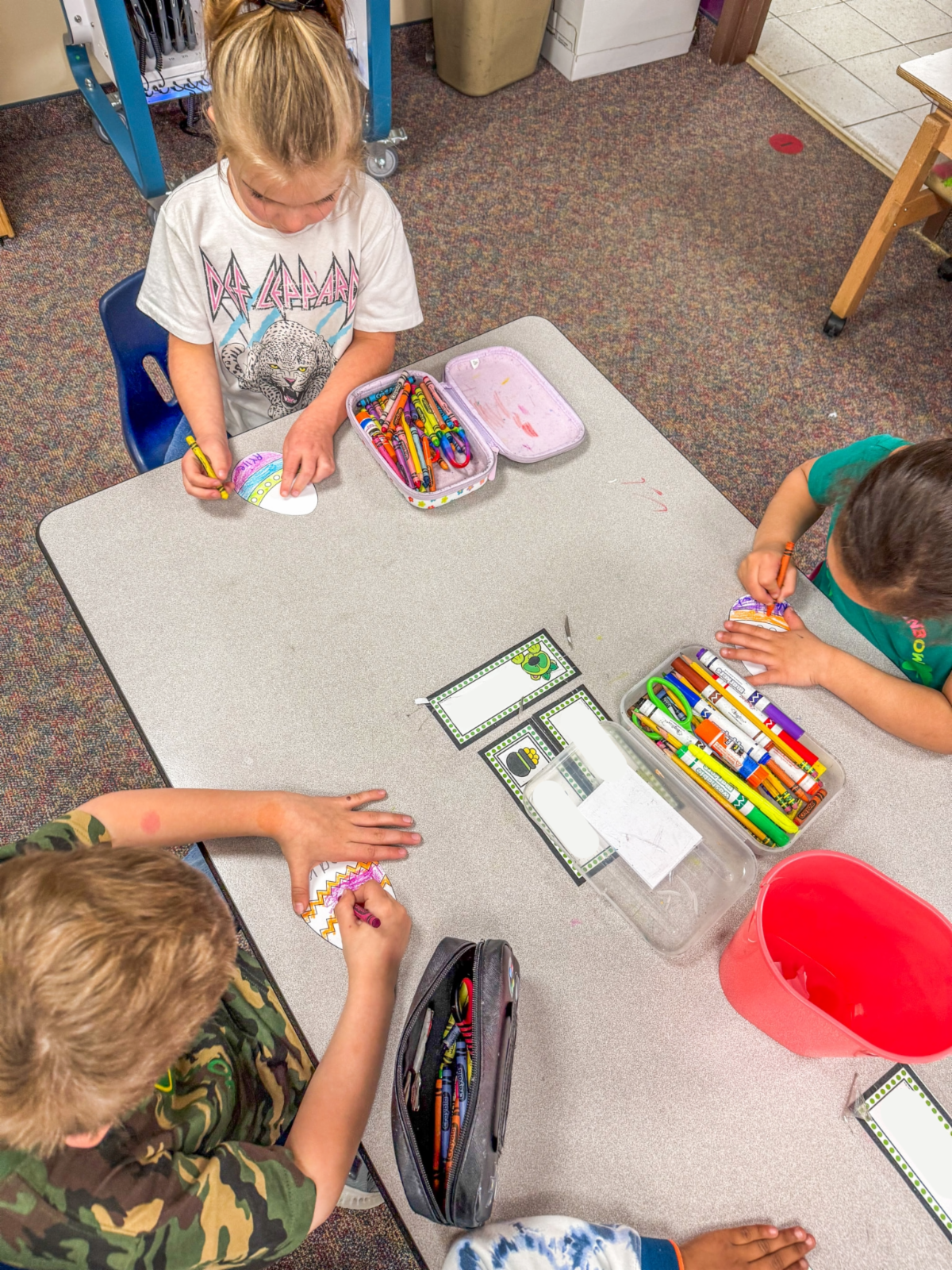 Students working on coloring their eggs.