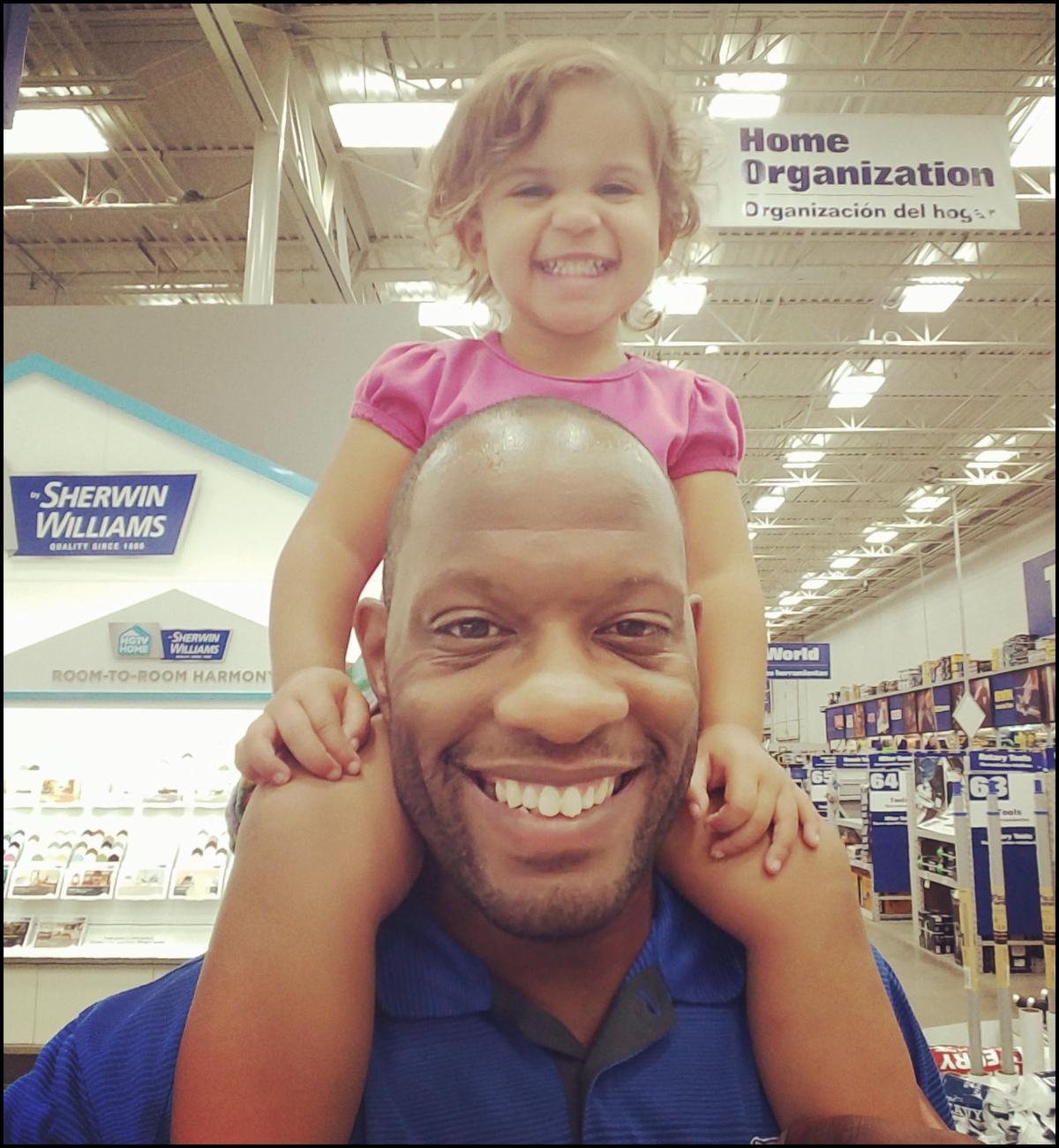 Gregg and daughter on his shoulders