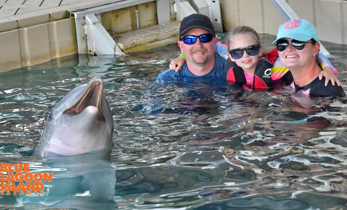 Sarah and family with a dolphin