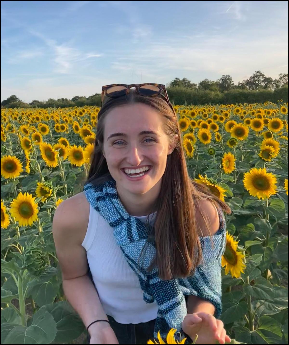 Orla Casserly in front of sunflowers