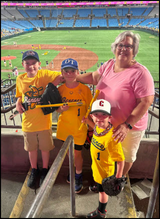 Susan Medlin with grandchildren at a baseball game
