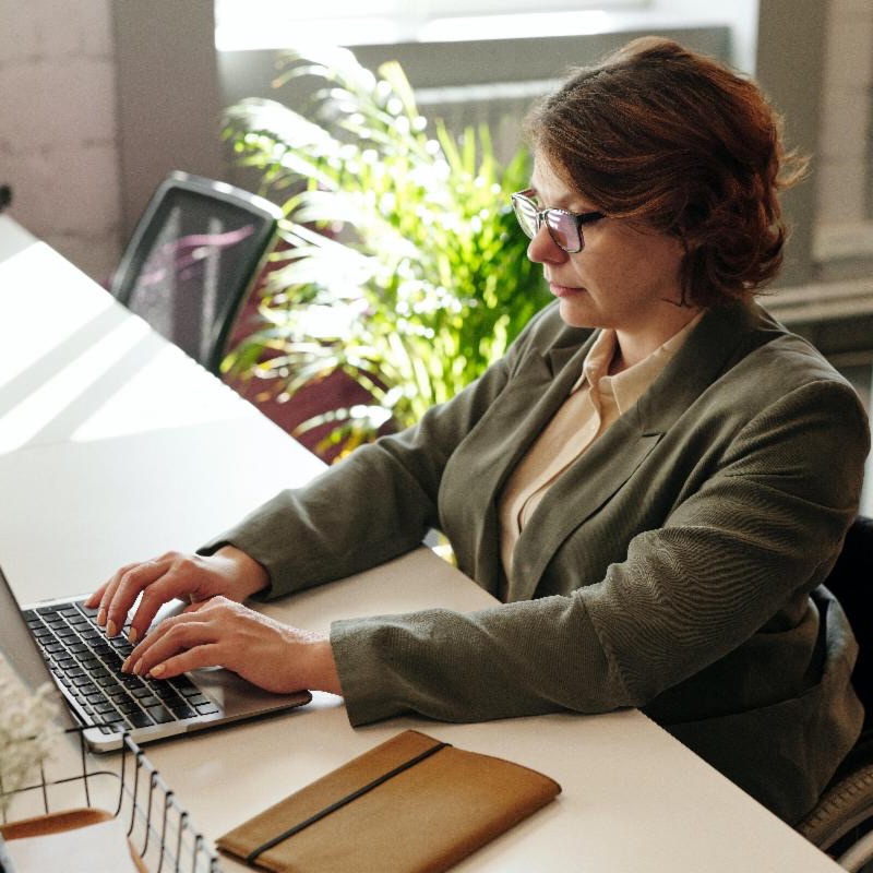 Woman typing on a computer