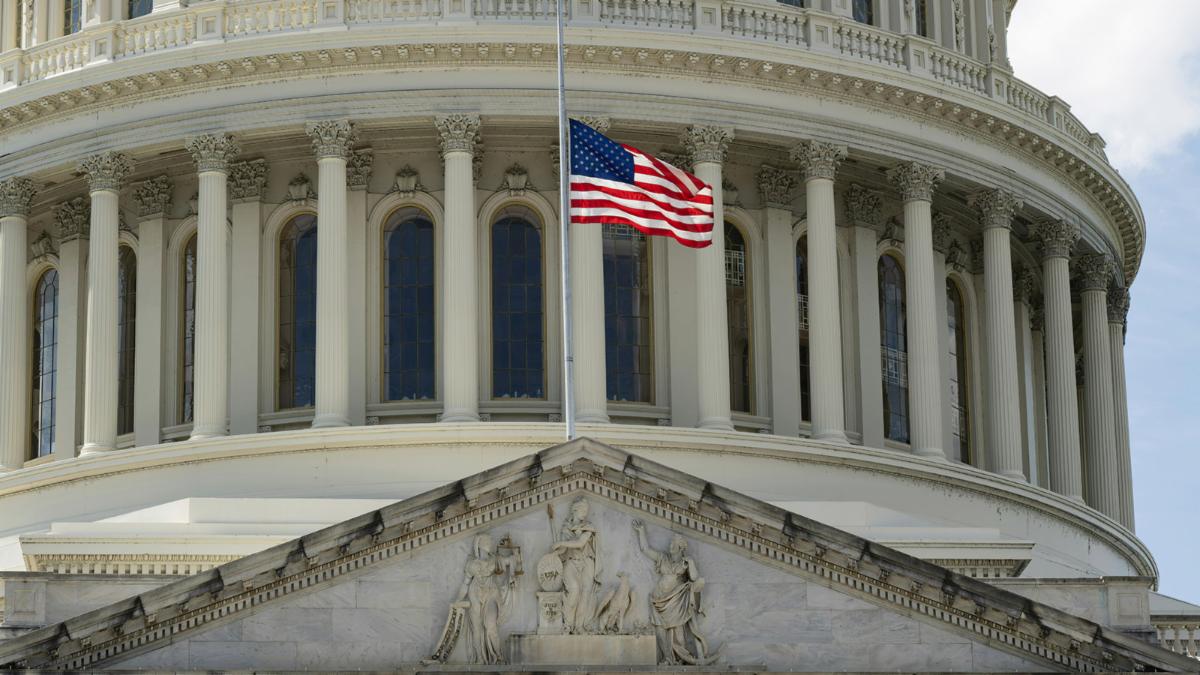 closeup of U.S. capitol building with flag