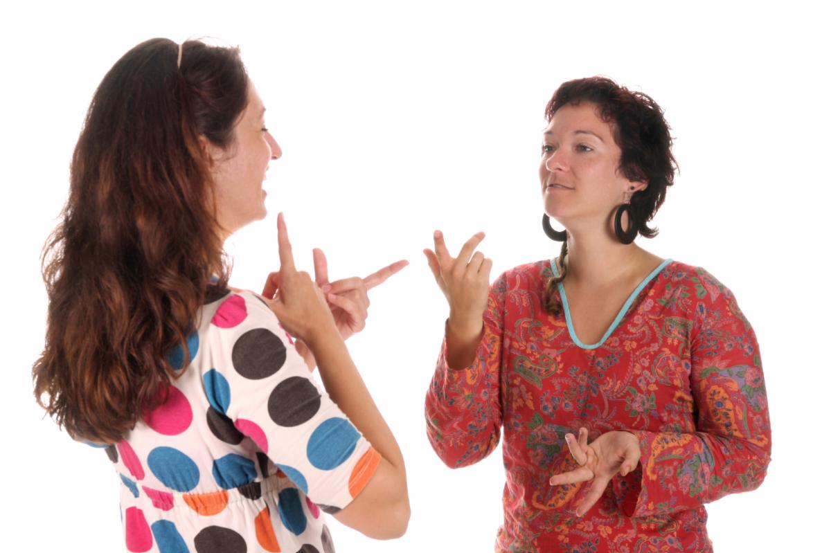 Two women speaking in sign language