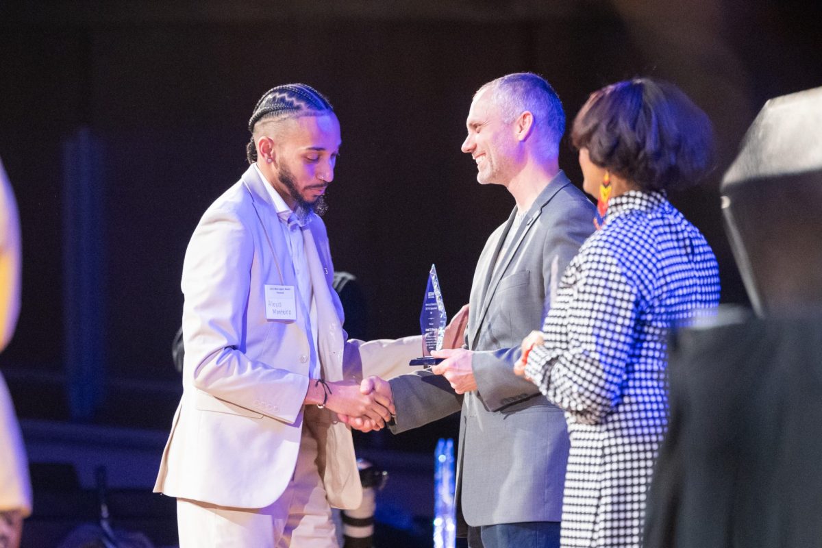 photo of student accepting legacy award