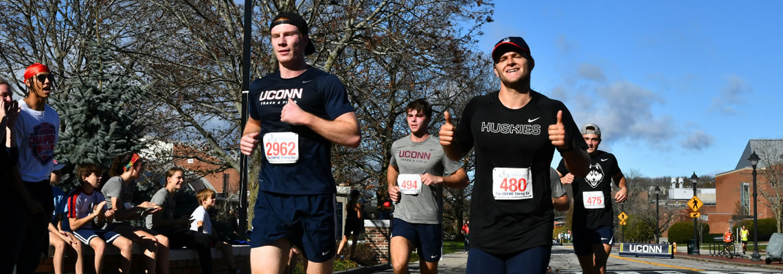 Two men doing a run marathon in the streets of Mansfield.