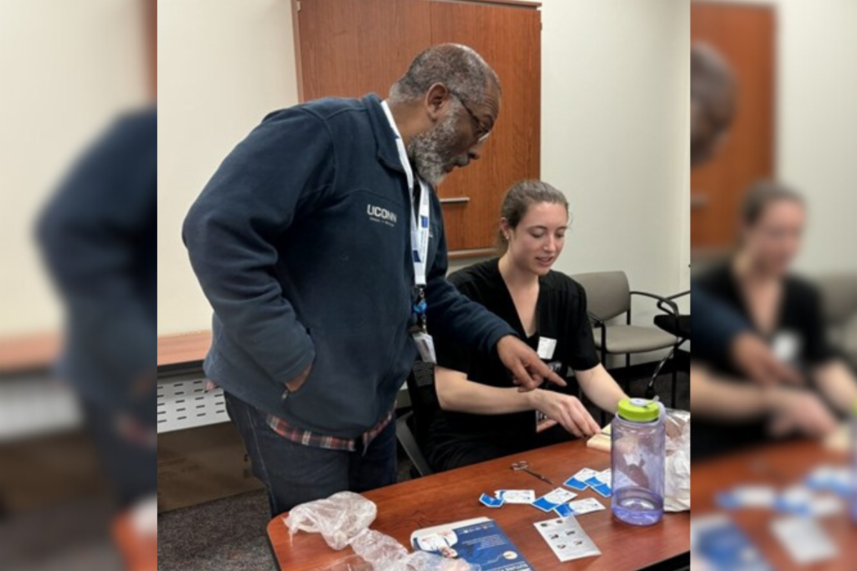 Dr. Anton Alerte at a suturing workshop of CT AHEC at the Family Medicine Center at Asylum Hill (Photo by CT AHEC).