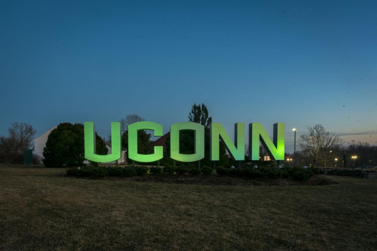 Picture of a UConn sign with green color