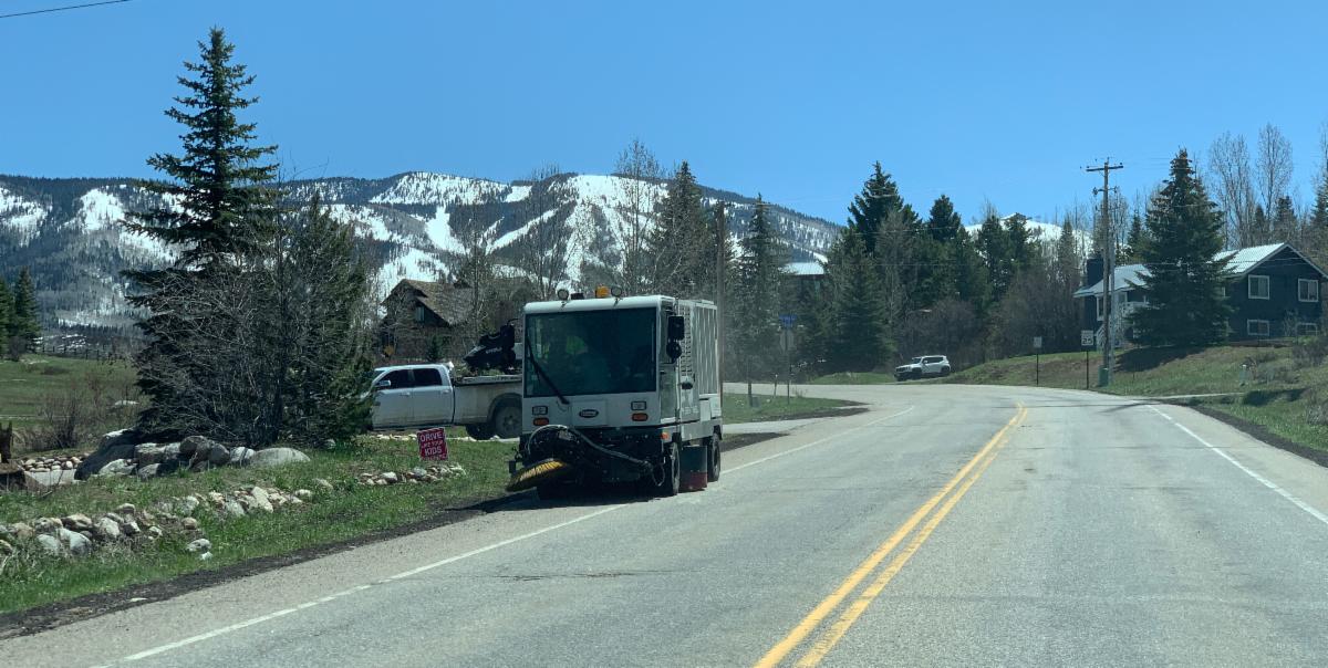 Street sweeper cleaning a city street in Steamboat Springs, CO.