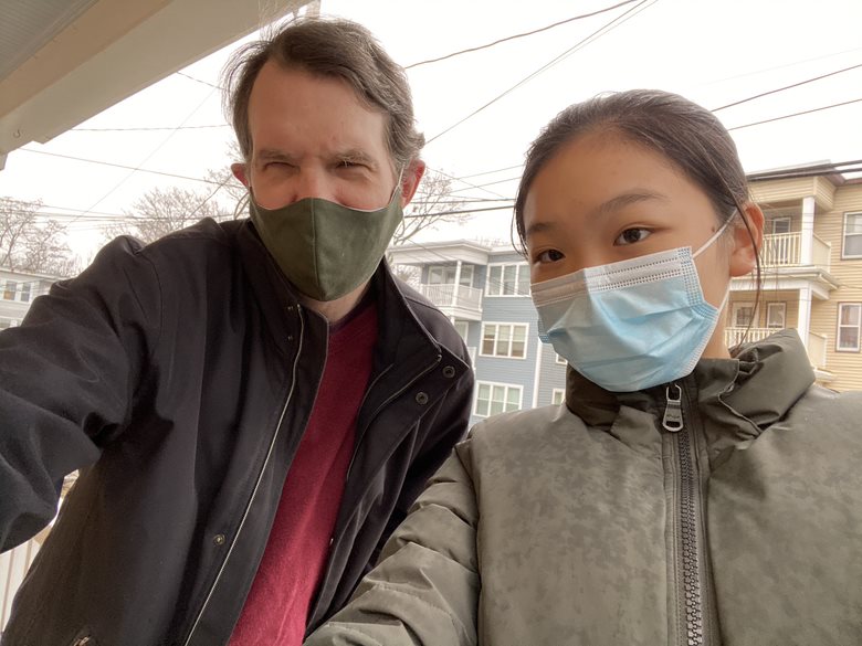 Mike on the left and Lily on the right. Both are wearing masks