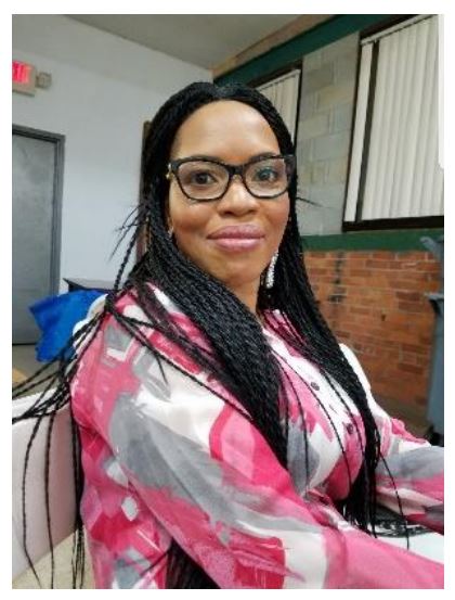 Adenike Ogundeide sitting at a desk