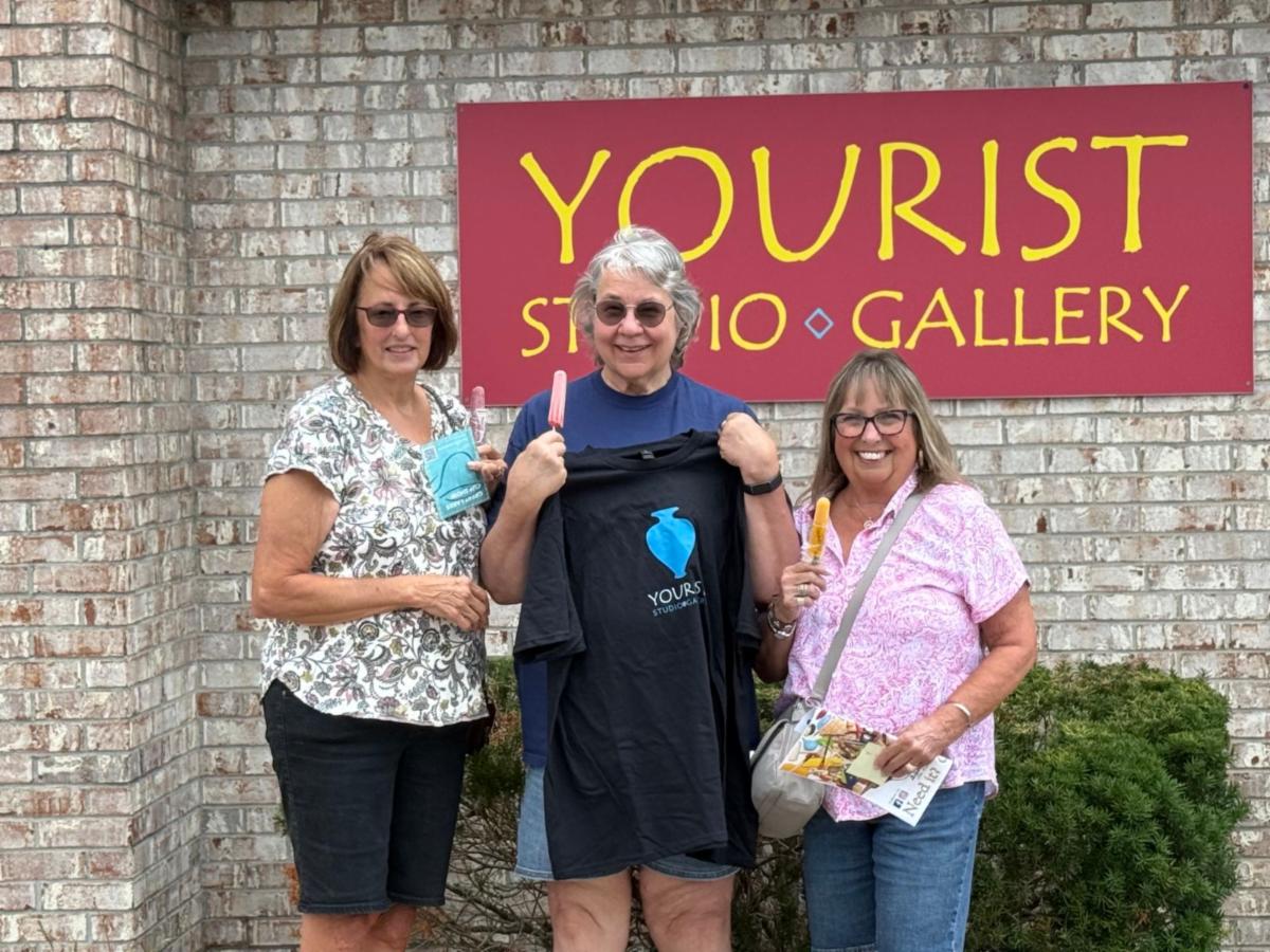 Lynn Friesen Davis and friends showing off the t shirt that Lynn won in our NCECA giveaway.