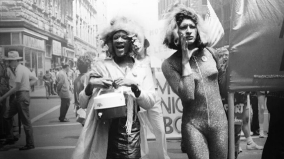 Photo of Marsha P. Johnson and Sylvia Rivera marching beside one another