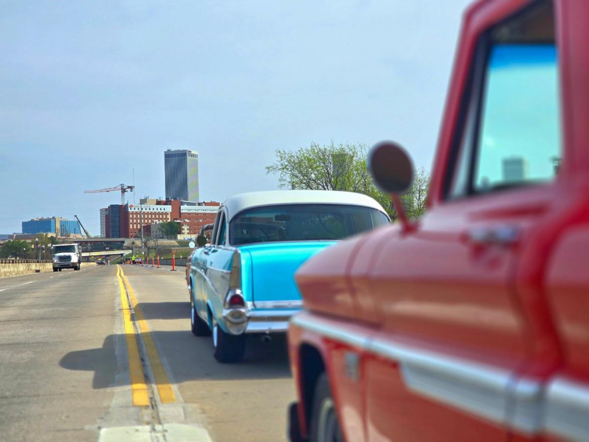 Two classic cars get ready to drive over the new Musical Road on Route 66. 