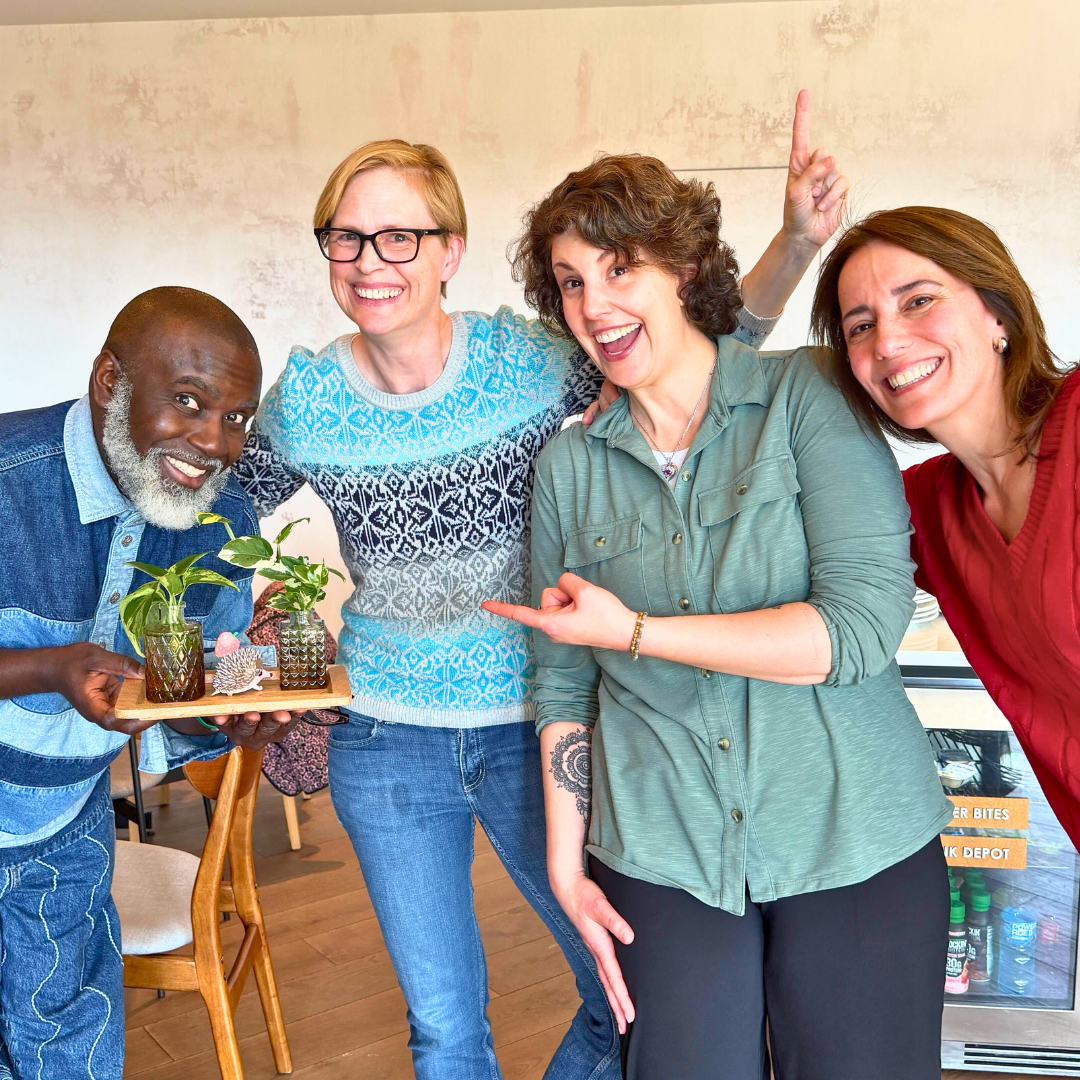 Suzanne Kiss with three members of the Young Futures Academy cohort smiling after finding their last scavenger hunt clue.