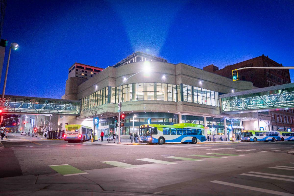 An image of buses moving in and out of STA Plaza downtown at night