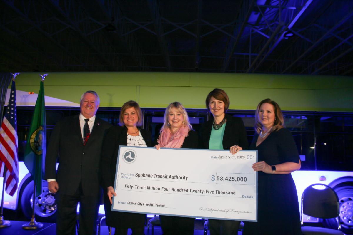A photo of Susan and others at a City Line funding event