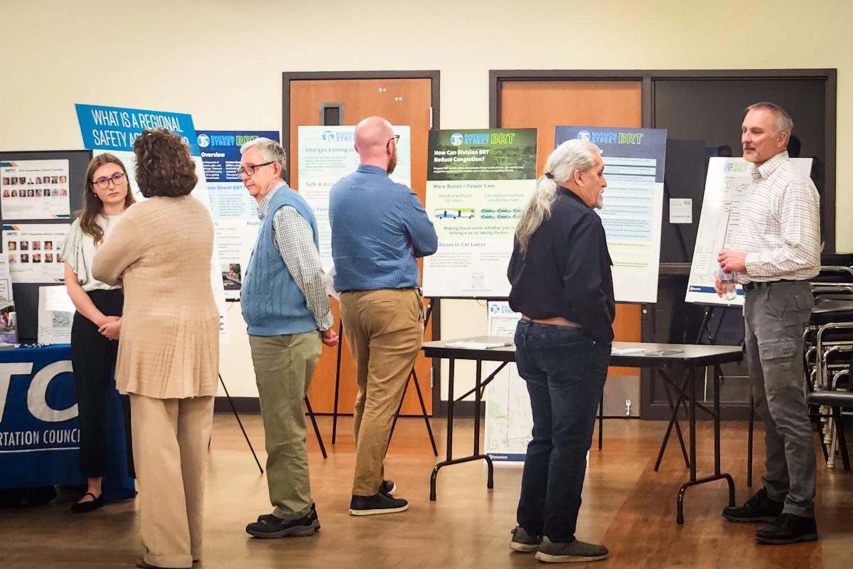 A photo of members of the public conversing at one of STA’s recent open houses