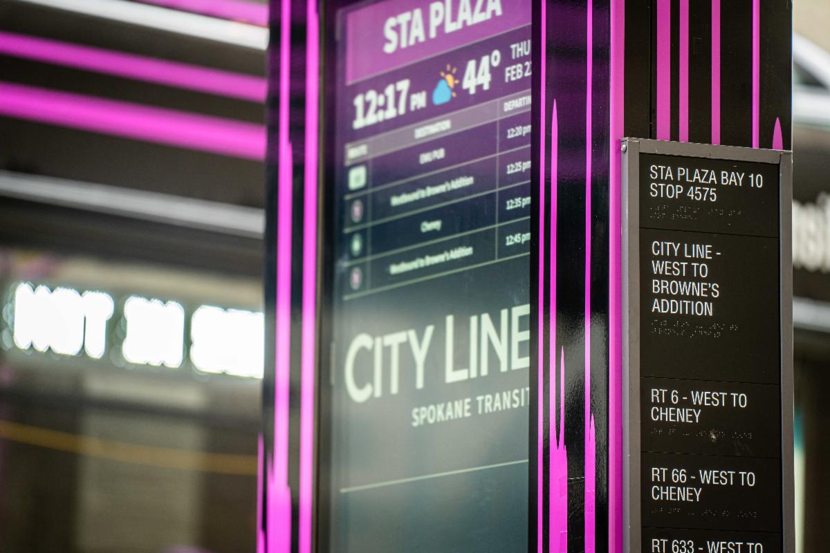 A photo of tactile and Braille signs on a City Line marker at STA Plaza