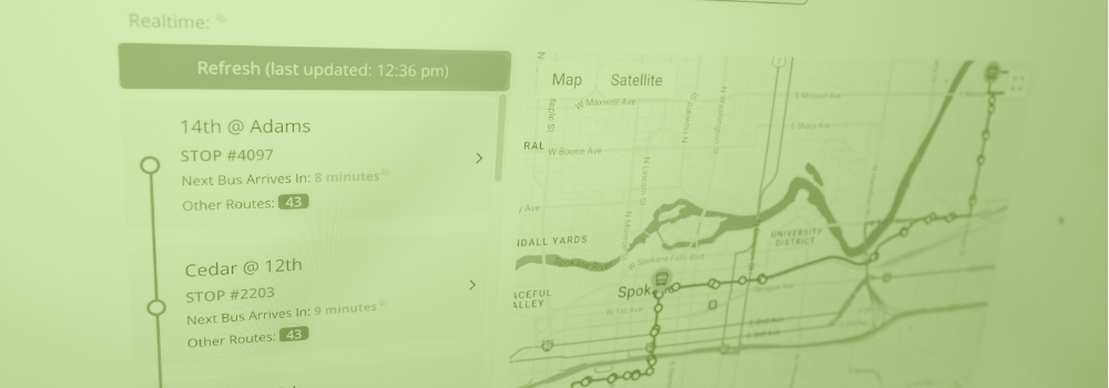 A green duotone photo of the STA website featuring its new real-time features, especially its real-time bus tracker map