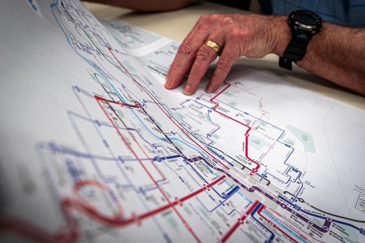 A photo of a person holding STA's system map