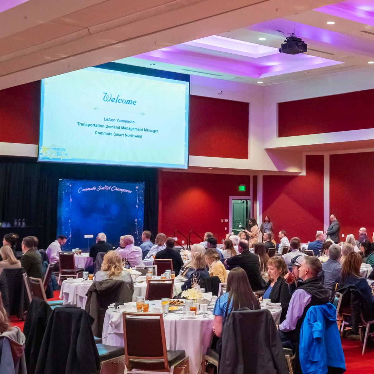 A photo of people seated at tables at the Commute Smart NW award ceremony at Davenport Grand